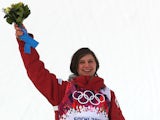 Bronze medalist Kim Lamarre of Canada celebrates on the podium during the flower ceremony for the Freestyle Skiing Women's Ski Slopestyle Finals on February 11, 2014