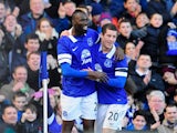 Everton's Lacina Traore celebrates with teammate Ross Barkley after scoring the opening goal against Swansea during their FA Cup fifth round match on February 9, 2014