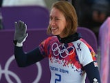 Lizzy Yarnold of Great Britain waves after her run during the Women's Skeleton heats on Day 6 of the Sochi 2014 Winter Olympics at Sliding Center Sanki on February 13, 2014