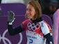 Lizzy Yarnold of Great Britain waves after her run during the Women's Skeleton heats on Day 6 of the Sochi 2014 Winter Olympics at Sliding Center Sanki on February 13, 2014