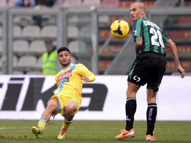 Napoli's Lorenzo Insigne scores his team's second goal against Sassuolo during their Serie A match on February 16, 2014