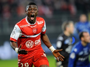Valenciennes' Ghanian forward Majeed Waris celebrates after scoring a goal during the French L1 football match Valenciennes vs Bastia at the Stade du Hainaut in Valenciennes on January 11, 2014