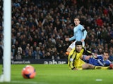 Steven Jovetic of Manchester City scores the first goal past Petr Cech of Chelsea during the FA Cup Fifth Round match sponsored by Budweiser between Manchester City and Chelsea at Etihad Stadium on February 15, 2014