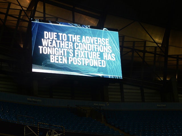 A message reading confirming the postponement of the English Premier League football match between Manchester City and Sunderland is displayed inside the empty Etihad Stadium in Manchester, north-west England, on February 12, 2014