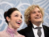 USA pair Meryl Davis and Charlie White wait for their marks in the 'kiss and cry' zone during the Figure Skating Ice Dance Short Dance at the Iceberg Skating Palace on February 16, 2014