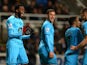 Emmanuel Adebayor of Tottenham Hotspur celebrates scoring the opening goal with team mates during the Barclays Premier League match between Newcastle United and Tottenham Hotspur at St James' Park on February 12, 2014