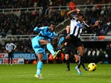 Emmanuel Adebayor of Tottenham Hotspur scores their third goal during the Barclays Premier League match between Newcastle United and Tottenham Hotspur at St James' Park on February 12, 2014