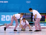 Torger Nergaard of Norway releases the stone during the Curling Men's Round Robin match between Great Britain and Norway on day 9 of the Sochi 2014 Winter Olympics at Ice Cube Curling Center on February 16, 2014