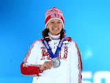 Silver medalist Olga Vilukhina of Russia celebrates during the medal ceremony for the Biathlon Women's 7.5 km Sprint on day 3 of the Sochi 2014 Winter Olympics at Medals Plaza in the Olympic Park on February 10, 2014