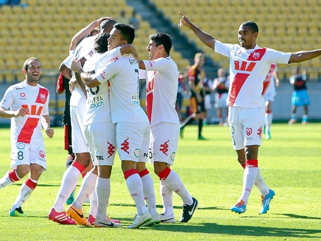 Melbourne Heart's Orlando Engelaar is congratulated by teammates after scoring his team's opening goal against Wellington Phoenix in their A-League match on February 16, 2014