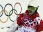 Canada's Philippe Marquis celebrates his first run in the Men's Freestyle Skiing Moguls finals at the Rosa Khutor Extreme Park during the Sochi Winter Olympics on February 10, 2014