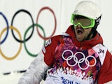 Canada's Philippe Marquis celebrates his first run in the Men's Freestyle Skiing Moguls finals at the Rosa Khutor Extreme Park during the Sochi Winter Olympics on February 10, 2014