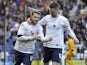 Joe Garner of Preston North End celebrates with team-mate Jake Larkins after he scores the first goal of the game for his side from the penalty spot during the Sky Bet League One match between Preston North End and Leyton Orient at Deepdale on February 15