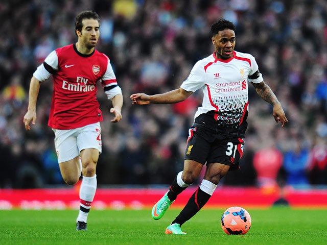 Liverpool's Raheem Sterling and Arsenal's Mathieu Flamini in action during their FA Cup fifth round match on February 9, 2014