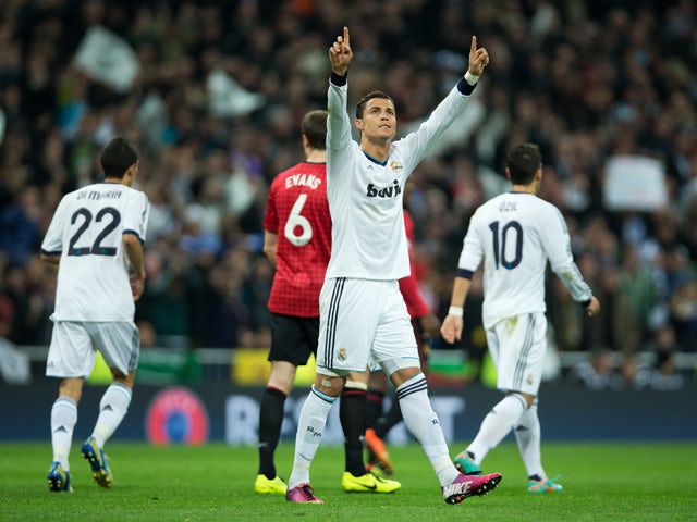 Cristiano Ronaldo of Real Madrid celebrates scoring his sides equalizing goal during the UEFA Champions League Round of 16 first leg match between Real Madrid and Manchester United at Estadio Santiago Bernabeu on February 13, 2013