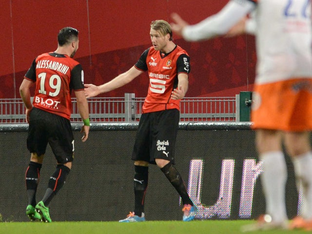 Rennes' forward Ola Toivonen celebrates with Romain Alessandrini after scoring during the French L1 football match between Rennes and Montpellier on February 15, 2014