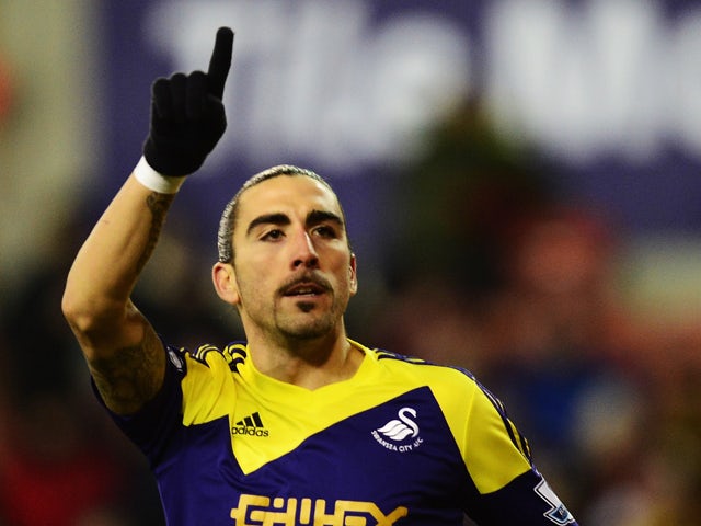 Chico Flores of Swansea City celebrates scoring during the Barclays Premier League match between Stoke City and Swansea City at the Britannia Stadium on February 12, 2014