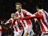 Peter Crouch of Stoke City celebrates after scoring during the Barclays Premier League match between Stoke City and Swansea City at the Britannia Stadium on February 12, 2014