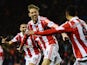 Peter Crouch of Stoke City celebrates after scoring during the Barclays Premier League match between Stoke City and Swansea City at the Britannia Stadium on February 12, 2014
