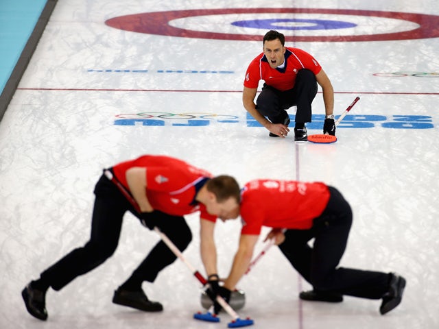 David Murdoch of Great Britain watches on as teammates Michael Goodfellow and Scott Andrews competes in the men's round robin session against Germany during day four of the Sochi 2014 Winter Olympics at Ice Cube Curling Center on February 11, 2014