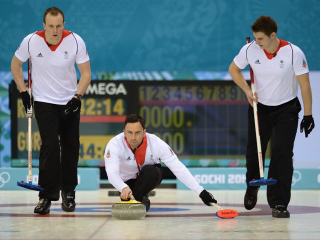 Britain's David Murdoch throws the stone during the 2014 Sochi winter olympics men's curling round robin session 1 match against Russia at the Ice Cube curling centre in Sochi on February 10, 2014