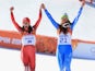 Dominique Gisin of Switzerland and Slovenia's Tina Maze celebrate their shared Winter Olympics gold medal in the women's downhill skiing at Sochi 2014