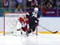 T.J. Oshie of the United States scores on a shootout against Sergei Bobrovski #72 of Russia during the Men's Ice Hockey Preliminary Round Group A game on February 15, 2014