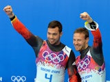 Gold Medallists, Germany's Tobias Arlt and Tobias Wendl celebrate at the Luge Doubles Flower Ceremony at the Sanki Sliding Center during the Sochi Winter Olympics on February 12, 2014