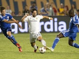 Real Madrid's Tomas Mejias is covered by Chelsea's Marko van Ginkle (L) and Ramires during the 2013 International Champions Cup match between Real Madrid and Chelsea on August 7, 2013
