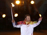 Vladislav Tretyak runs to light the Olympic cauldron at the opening ceremony of the 2014 Winter Olympics on February 7, 2014