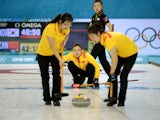 China's Wang Bingyu watches the stone during the Women's Curling Round Robin Session 7 against South Korea at the Ice Cube Curling Center during the Sochi Winter Olympics in Sochi on February 14, 2014