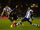 Eden Hazard of Chelsea is tackled by Morgan Amalfitano of West Brom during the Barclays Premier League match between West Bromwich Albion and Chelsea at The Hawthorns on February 11, 2014