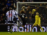 Victor Anichebe of West Brom heads in their first goal past Petr Cech of Chelsea during the Barclays Premier League match between West Bromwich Albion and Chelsea at The Hawthorns on February 11, 2014 