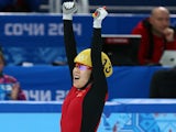 Yang Zhou of China celebrates winning the gold medal from Suk Hee Shim of South Korea during the Ladies' 1500 m Final Short Track Speed Skating on February 15, 2014