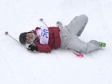 Canada's Yuki Tsubota crashes at the Women's Freestyle Skiing Slopestyle finals at the Rosa Khutor Extreme Park during the Sochi Winter Olympics on February 11, 2014