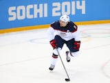 Zach Parise #9 of United States controls the puck during the Men's Ice Hockey Preliminary Round Group A game on day six of the Sochi 2014 Winter Olympics at Shayba Arena on February 13, 2014