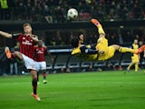 Atletico Madrid's Brazilian forward Diego da Silva Costa makes a bicycle kick during the Champions League match between AC Milan and Atletico Madrid, on February 19, 2014