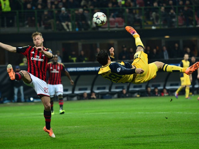 Atletico Madrid's Brazilian forward Diego da Silva Costa makes a bicycle kick during the Champions League match between AC Milan and Atletico Madrid, on February 19, 2014