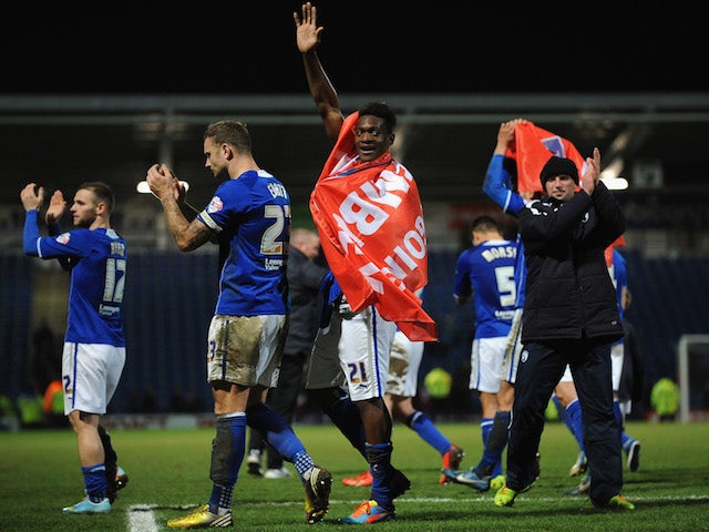 Armand Gnanduillet of Chesterfield celebrates after reaching the final of the Johnstone's Paint Northern Area Final match at Proact Stadium on February 18, 2014