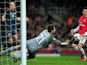 Lukasz Fabianski of Arsenal makes a save during the UEFA Champions League Round of 16 first leg match between Arsenal and FC Bayern Muenchen at Emirates Stadium on February 19, 2014