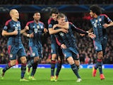 Bayern Munich's midfielder Toni Kroos celebrates after scoring his team's first goal during the UEFA Champions League Last 16, first leg football match between Arsenal and Bayern Munich at The Emirates Stadium in north London on February 19, 2014
