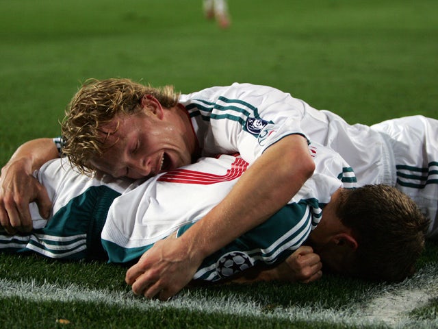 Liverpool's Craig Bellamy celebrates with Dirk Kuyt after scoring against Barcelona during the first leg of a last 16 Champions League football match at the Camp Nou stadium in Madrid, 21 February 2007