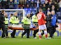 Ben Watson of Wigan is taken off injured during the Sky Bet Championship match between Wigan Athletic and Barnsley at the DW Stadium on February 18, 2014
