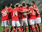 Benfica players celebrates the opening goal against Paok Thessaloniki during their Europa League match on February 20, 2014
