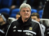 Hull City's English manager Steve Bruce is pictured before the start of the English FA Cup fifth round football match between Brighton & Hove Albion and Hull City at The American Express Community Stadium in Brighton, southern England on February 17, 2014