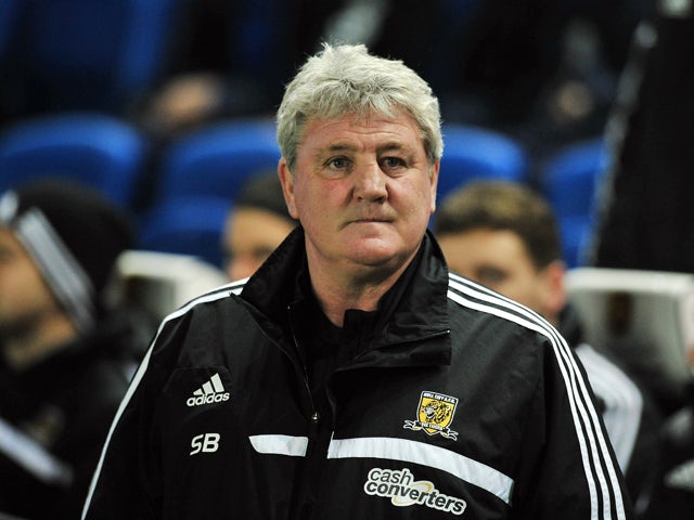 Hull City's English manager Steve Bruce is pictured before the start of the English FA Cup fifth round football match between Brighton & Hove Albion and Hull City at The American Express Community Stadium in Brighton, southern England on February 17, 2014