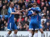 Nikica Jelavic of Hull celebrates with team mates after scoring the team's second goal during the Barclays Premier League match between Cardiff City and Hull City at Cardiff City Stadium on Febuary 22, 2014