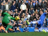 Chelsea's English defender John Terry lunges toward the ball as Everton's US goalkeeper Tim Howard fails to make the save leading to the winning goal from a free kick by Chelsea's English midfielder Frank Lampard during the English Premier League football