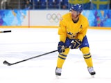 Daniel Alfredsson #11 of Sweden skates against Latvia during the Men's Ice Hockey Preliminary Round Group C game on day eight of the Sochi 2014 Winter Olympics at Shayba Arena on February 15, 2014
