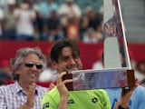 Spanish tennis player David Ferrer poses with the 2014 ATP Buenos Aires trophy after defeating Italian Fabio Fognini 6-4, 6-3, on February 16, 2014